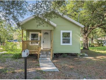 Charming bungalow with a quaint front porch and updated paint at 3103 E Emma St, Tampa, FL 33610