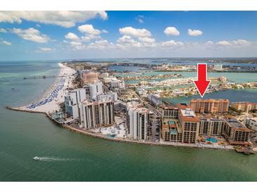Aerial view showcases the building's location along the beach with close proximity to shopping and dining at 530 S Gulfview Blvd # 303, Clearwater, FL 33767