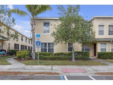 Charming two-story home featuring well-maintained landscaping and a welcoming facade, perfect for families at 12937 Trade Port Pl, Riverview, FL 33579