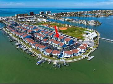 Coastal condo complex with marina, park, and stunning waterfront views at 343 Rex Pl # G, Madeira Beach, FL 33708
