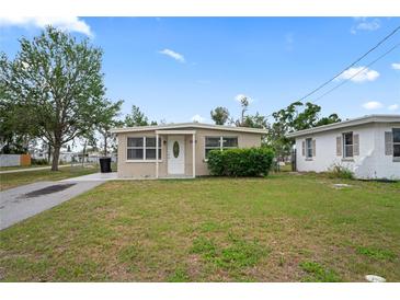 Charming single-story home featuring a well-maintained front yard and a classic architectural design at 5300 6Th S Ave, St Petersburg, FL 33707