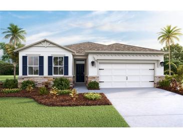 Charming single-Gathering home featuring a two-car garage, manicured lawn, and stone accents at 7775 Wheat Stone Dr, Zephyrhills, FL 33540