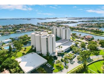 Stunning aerial view of luxury condominium complex surrounded by lush landscaping and beautiful waterfront views at 5940 Pelican Bay S Plz # 1105, Gulfport, FL 33707