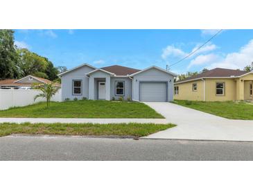 Charming single-story home with well-manicured lawn and inviting curb appeal at 8505 N Brooks St, Tampa, FL 33604