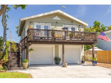 Charming home with two-car garage and upper deck at 224 Ontario Ave, Crystal Beach, FL 34681
