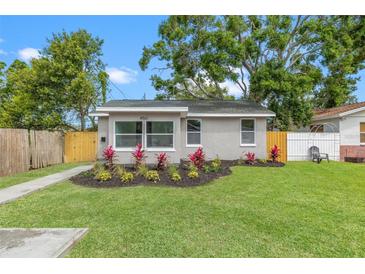 Charming single story home with lush green lawn and appealing landscaping at 4561 21St S Ave, St Petersburg, FL 33711