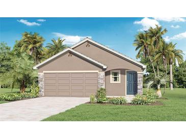 Charming one-story home with stone accents, a neutral color palette, and an attached two-car garage at 5226 Salt Marsh Rd, Wimauma, FL 33598