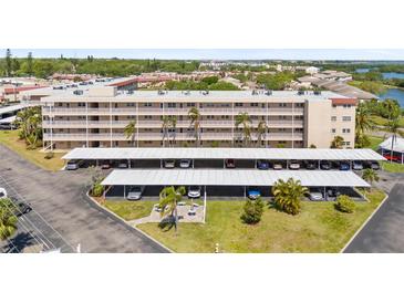 Well-maintained condo building with covered parking, lush landscaping and nearby water access at 9950 62Nd N Ter # 316, St Petersburg, FL 33708