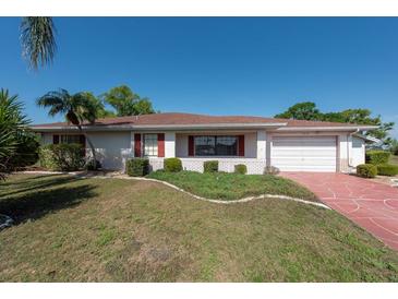 Charming single-story home with well-maintained lawn and classic curb appeal at 103 El Turco Ct, Sun City Center, FL 33573