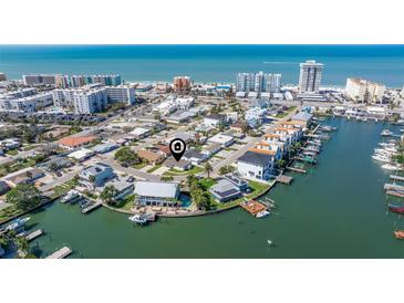 Stunning aerial view of a waterfront community with beach access and canal access at 145 174Th Terrace E Dr, Redington Shores, FL 33708