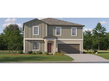 Charming two-story home with a well-manicured lawn and attached two-car garage in a tranquil neighborhood at 1814 Tropical Oasis Ave, Plant City, FL 33565