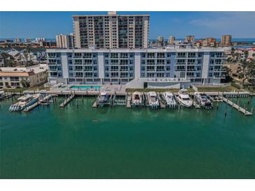Stunning waterfront condos with boat slips, pool, and city views make this an amazing property at 415 Island Way # 205, Clearwater Beach, FL 33767