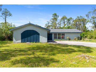 Charming single-story home featuring a spacious lawn and driveway, offering curb appeal at 116 Solana St, North Port, FL 34287
