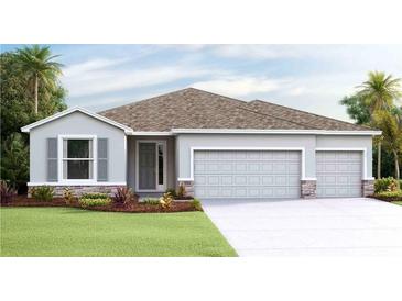 Charming single-story home featuring a stone-accented facade, a three-car garage, and well-manicured landscaping at 19657 Gladeview Way, Land O Lakes, FL 34638