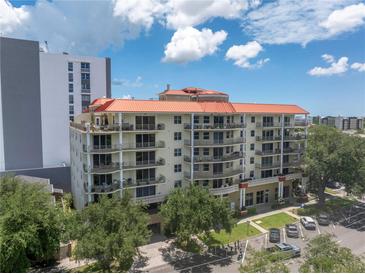 Beautiful multi-story condo building with orange roof, lots of balconies and manicured lawn at 750 4Th Avenue South # 601H, St Petersburg, FL 33701