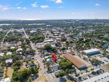 An aerial view showcases the neighborhood and proximity to the water at 439 E Boyer St, Tarpon Springs, FL 34689
