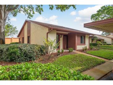 Charming single-story home with well-maintained lawn and inviting front entrance at 7501 Greystone Dr, Hudson, FL 34667