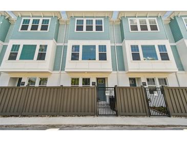 Charming townhome featuring a modern design and gated front yards for added privacy and curb appeal at 2121 1St N Ave, St Petersburg, FL 33713