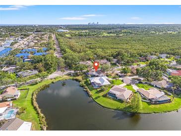 Beautiful aerial view of the property with a scenic lake and surrounding neighborhood at 7201 15Th Ne Ct, St Petersburg, FL 33702