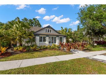Charming single-story home with lush landscaping, mature trees, and inviting curb appeal at 115 21St Ne Ave, St Petersburg, FL 33704
