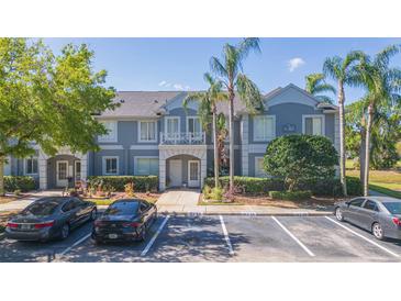 Charming two-story condo with well-manicured landscaping, ample parking, and a welcoming facade at 18236 Paradise Point Dr, Tampa, FL 33647