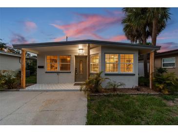 Charming home with a covered porch, updated tile and fresh exterior paint at 3066 Highland N St, St Petersburg, FL 33704