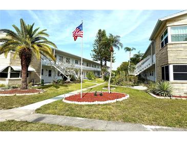 Well-maintained condo community featuring mature landscaping and an American flag at 5875 18Th N St # 19, St Petersburg, FL 33714