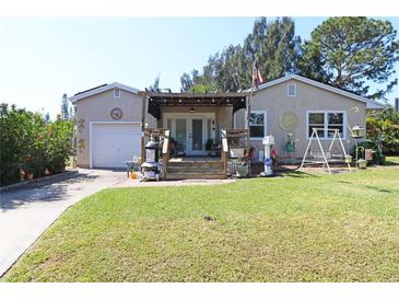 Charming single Gathering home with a spacious, well-maintained lawn and beautiful front porch at 2132 40Th N Ave, St Petersburg, FL 33714