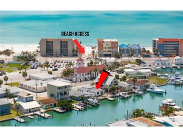Wonderful waterfront living featuring a spacious home with private boat dock and easy beach access at 248 137Th Cir, Madeira Beach, FL 33708