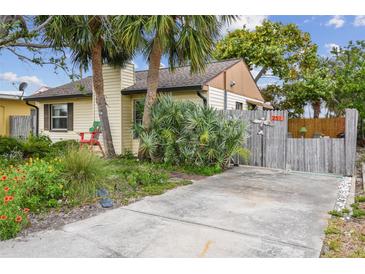 Charming single-story home with lush landscaping, palm trees, and inviting curb appeal in a desirable neighborhood at 251 72Nd Ave, St Pete Beach, FL 33706