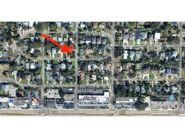 Overhead street view shows neighborhood with tree-lined streets and nearby shopping and dining at 4013 W North B St, Tampa, FL 33609
