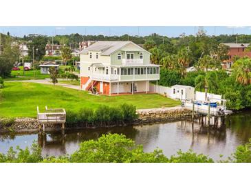 Two-story coastal home with a dock and waterfront access at 8932 Rocky Creek Dr, Tampa, FL 33615