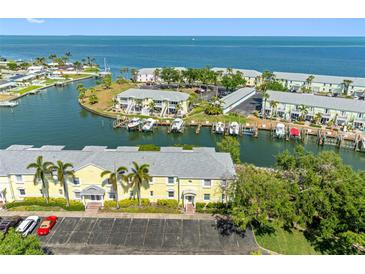 Scenic aerial view of waterfront community with docks, lush landscaping, and easy ocean access at 4740 Beach Se Dr # A, St Petersburg, FL 33705