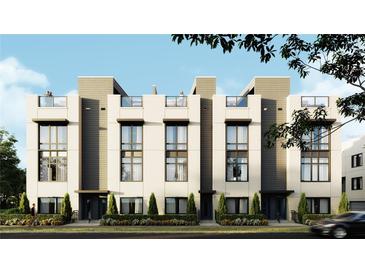 Modern townhome showcases a sleek design, large windows, and rooftop terraces for exceptional urban living at 4723 W Price Ave # 2, Tampa, FL 33611
