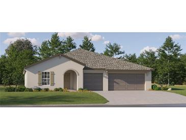 Charming one-story home with a two-car garage, arched entryway, and lush green lawn at 11860 Blue Diamond Trl, Parrish, FL 34219