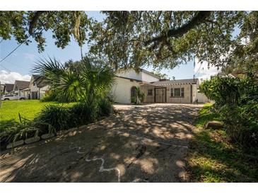 Charming single-Gathering home with mature landscaping and a spacious driveway at 3212 W Arch St, Tampa, FL 33607
