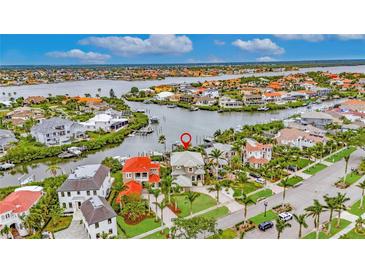 Stunning aerial view of waterfront home showcasing its prime location and gorgeous surrounding community at 6301 Marbella Blvd, Apollo Beach, FL 33572