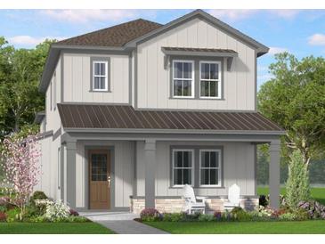 Charming two-story home featuring a covered porch and a combination of vertical and horizontal siding at 865 53Rd Ave N, St Petersburg, FL 33703