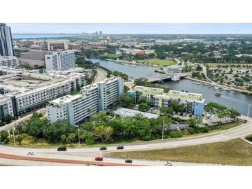 Stunning aerial view showcasing the condo buildings, the river, and the downtown skyline at 201 W Laurel St # 307, Tampa, FL 33602