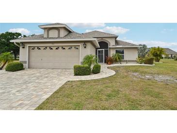 Charming single-Gathering home showcasing a well-manicured lawn, complemented by a two-car garage and neutral paint at 336 Northway Dr, Sun City Center, FL 33573