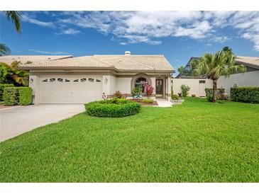 Charming single-story home with lush lawn and manicured landscaping at 5519 Greyston St, Palm Harbor, FL 34685