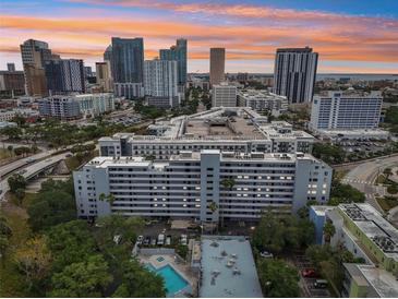 Stunning aerial view showcasing the building's architecture and downtown skyline at sunset at 201 Laurel # 308, Tampa, FL 33602