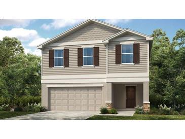 Charming two-story home featuring neutral siding, a two-car garage and a welcoming entryway, creating curb appeal at 12406 Gust Ct, Hudson, FL 34669