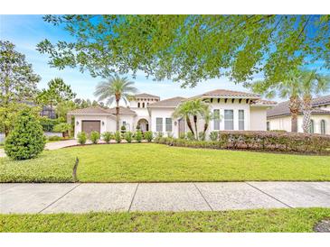 Charming single-story home featuring a well-manicured lawn and lush landscaping, set beneath a clear blue sky at 15305 Fishhawk Preserve Dr, Lithia, FL 33547