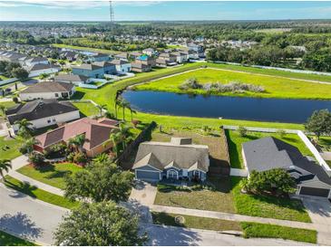 Charming single-Gathering home with a beautiful lake view and lush landscaping at 10540 Carloway Hills Dr, Wimauma, FL 33598