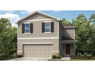 Charming two-story home boasts a two-car garage, complemented by lovely landscaping and neutral tones at 12400 Gust Ct, Hudson, FL 34669