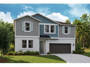 Charming two-story home boasts a modern design and inviting curb appeal at 14433 Meadow Bird Ave, Riverview, FL 33579