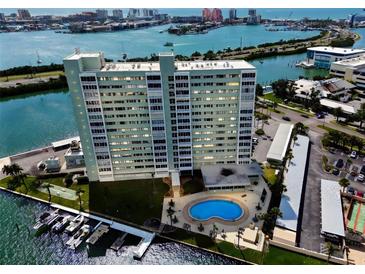 Stunning aerial view of waterfront condo with boat slips and pool overlooking beautiful bay views at 31 Island Way # 609, Clearwater Beach, FL 33767