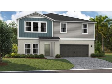 New construction home featuring a two-car garage, neutral color scheme, and an inviting front yard at 37073 Sagemoor Dr, Zephyrhills, FL 33541