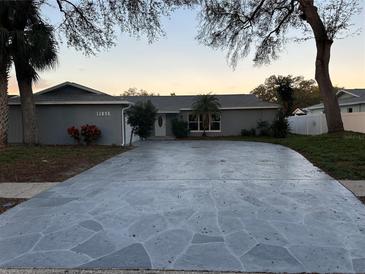 Charming single-story home featuring a spacious driveway and well-maintained landscaping at 11096 117Th Way, Seminole, FL 33778